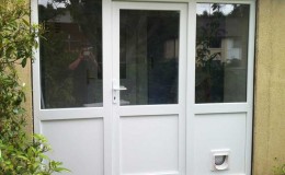 Renovated entrance with new uPVC door and twin side panels